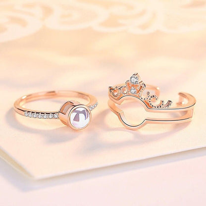 SET x2 ANILLOS 100 TE AMO™ — Proyección + Corona | Ajustable | Caja Regalo